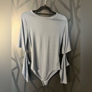 Women’s soft bodysuit with elbow cutouts